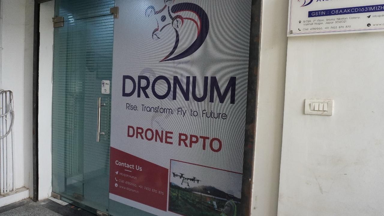 <p>Welcome to DRONUM India Aviation<br />
<br />
The front wall of our office reflects the essence of innovation and excellence that defines DRONUM India Aviation. Designed to inspire, it showcases our dedication to cutting-edge drone technology and aviation solutions. The sleek, modern design, adorned with our branding and core values, symbolizes professionalism and our passion for advancing aerial technologies. This wall is more than just a structure; it stands as a testament to our journey and vision for the future of drone technology in India. Step into our space and feel the energy that drives our mission to revolutionize the skies.</p>

